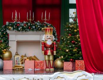 giant nutcracker beside Christmas tree