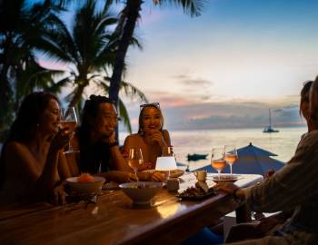 friends out at tropical bar restaurant