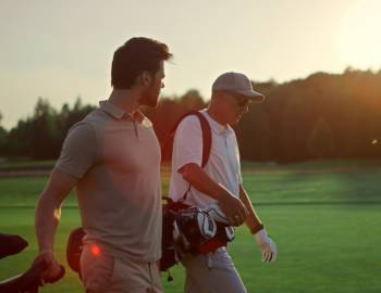 men walking on golf course