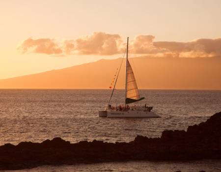 A catamaran at sunset