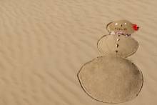 snowman on the sand on beach