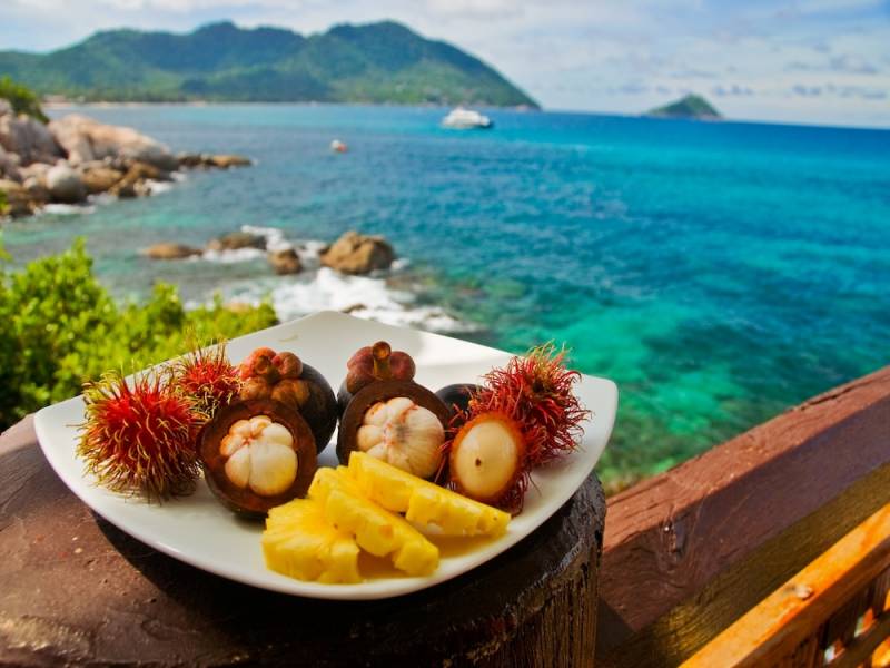 Pineapple and Pomegranates on beachside table