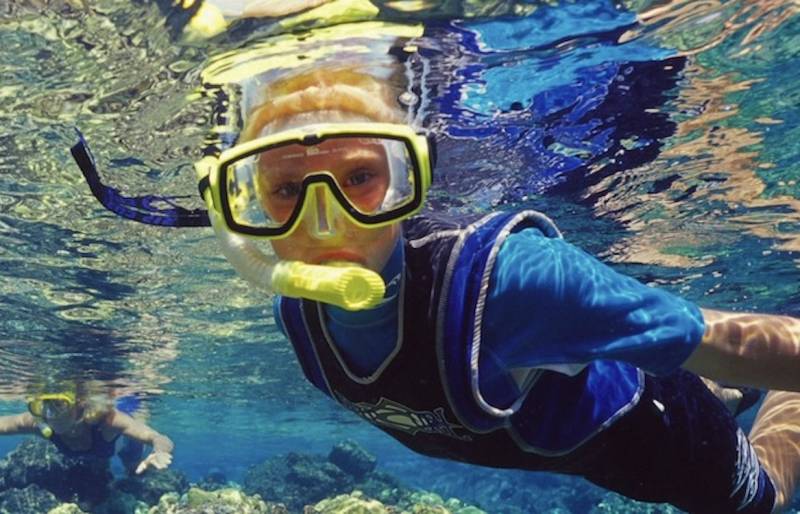 two people snorkeling.