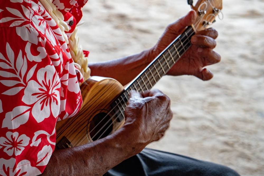 old man hands playing ukelele hawaii maui