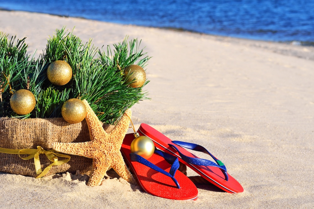 Christmas tree with christmas balls, slippers and starfish on th