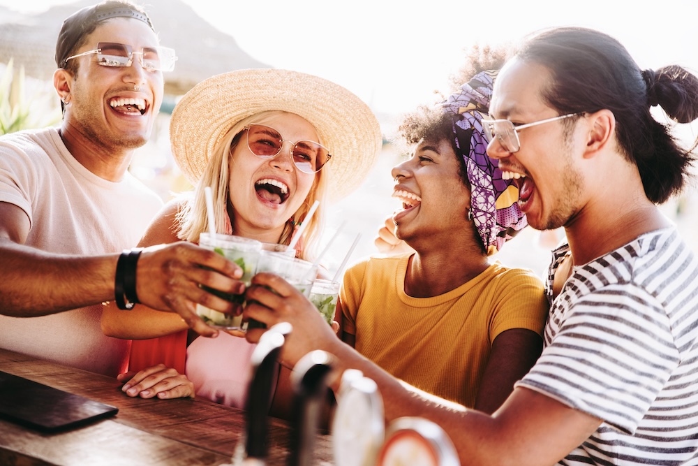 friends having drinks at a tropical beach bar