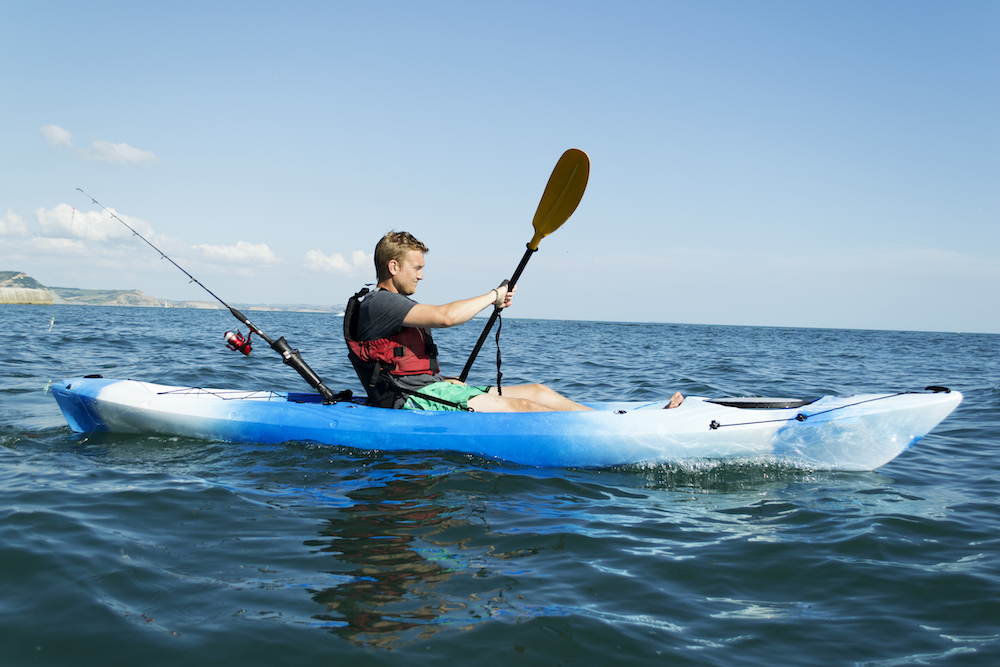 man fishing in a kayak